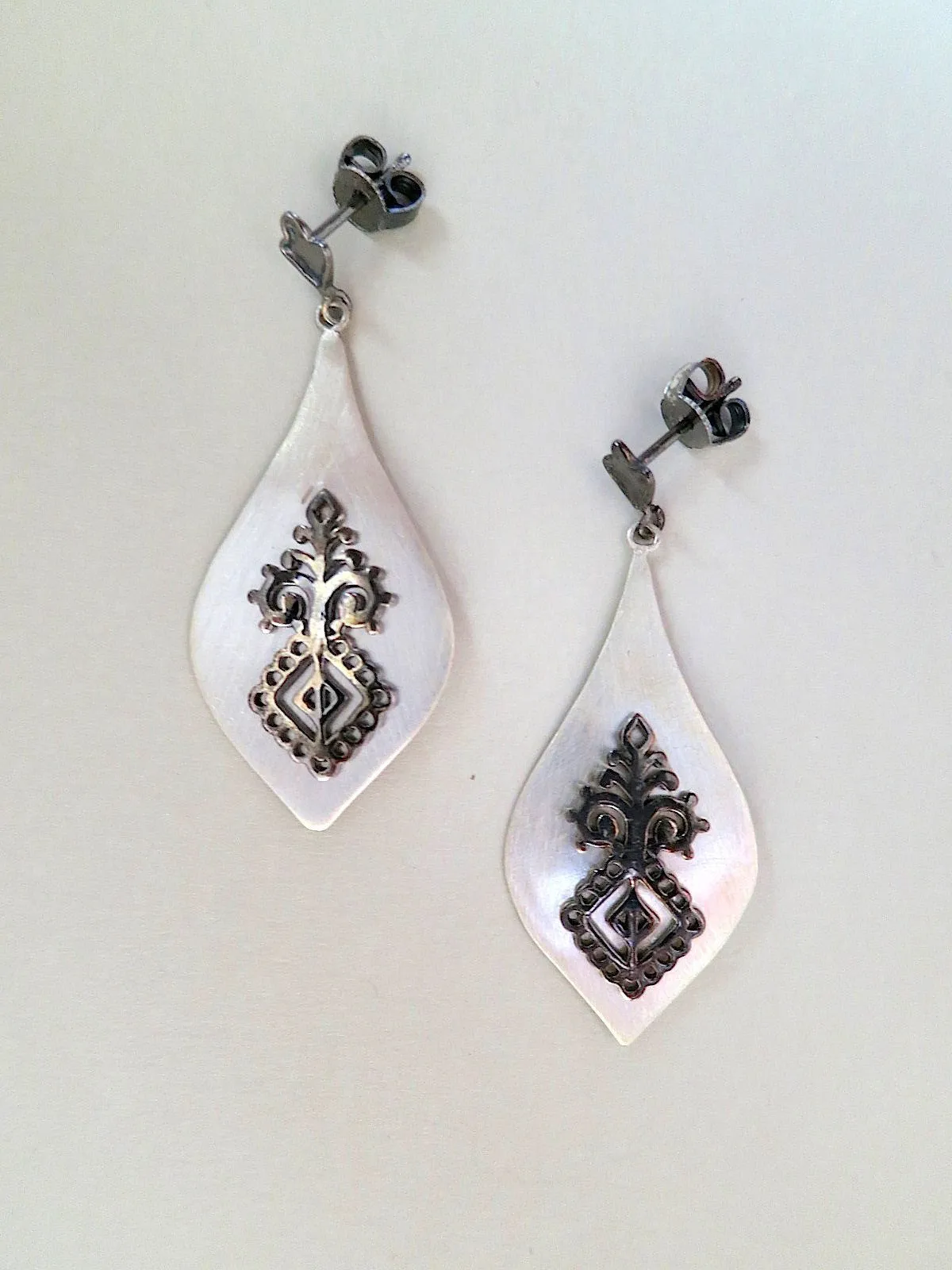 Elegant, dangle drop, satin finish earrings with black rhodium plated detailing