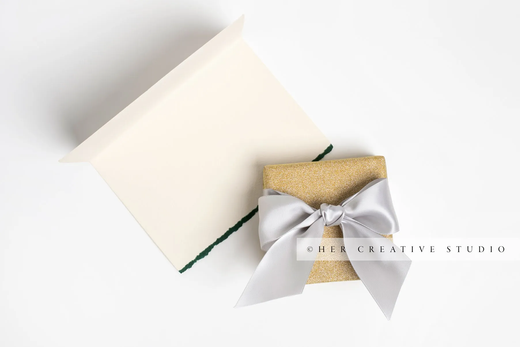 Gold Holiday Presents & Notecard on White Background