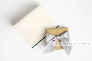 Gold Holiday Presents & Notecard on White Background