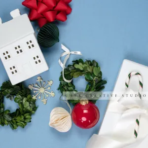 Holiday Home, Gift & Mini Wreath Flatlay on Sky Blue Background