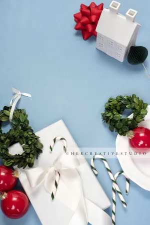 Holiday Home, Gift & Wreath on Sky Blue Background