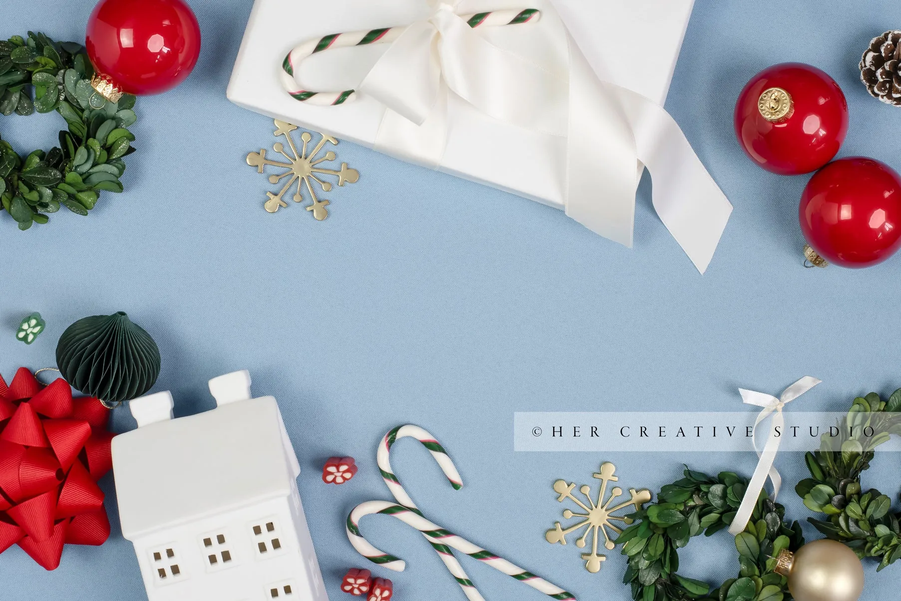 Holiday Ornaments & Viallage Home on Sky Blue Background