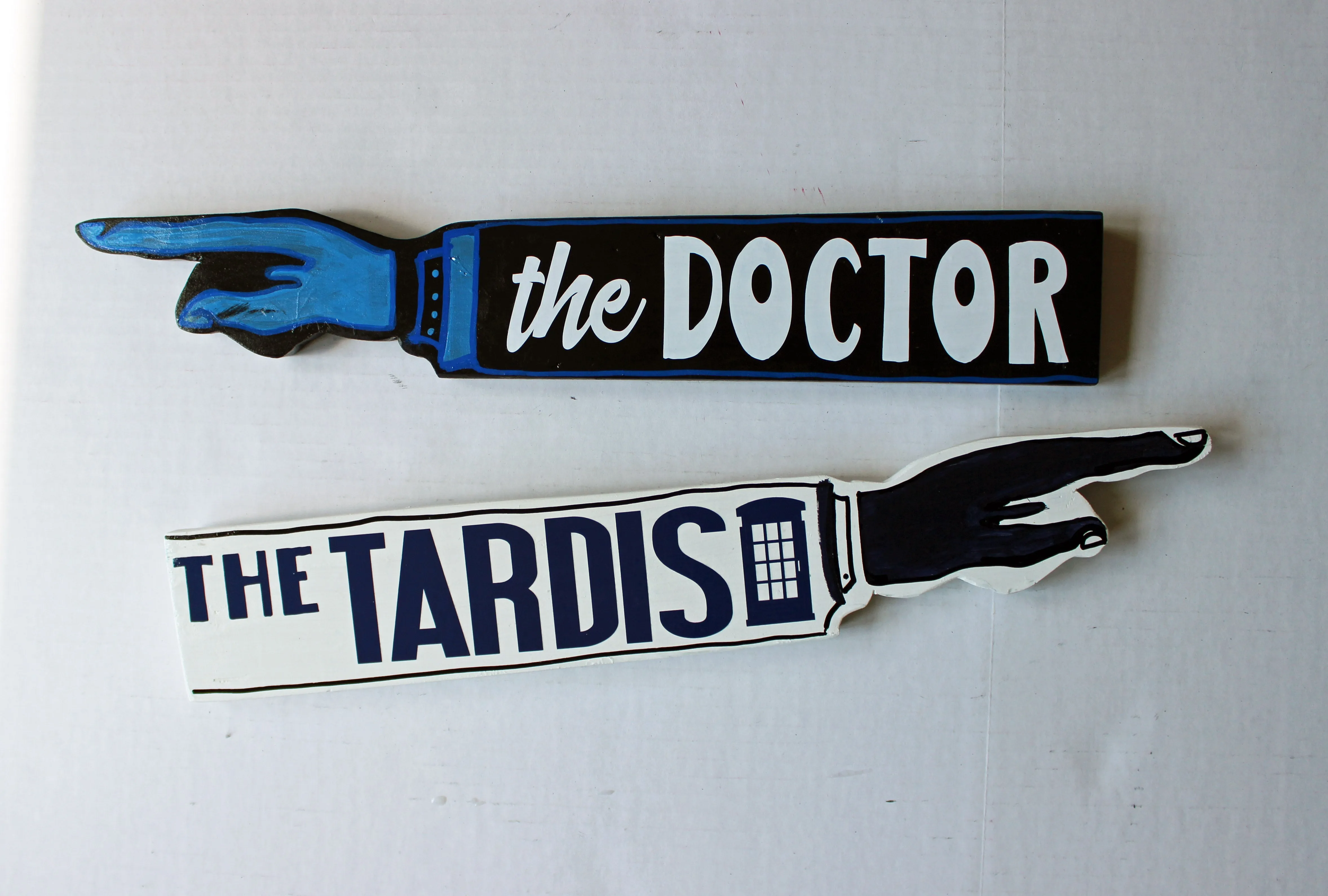 where's the doctor - wooden pointy finger signs