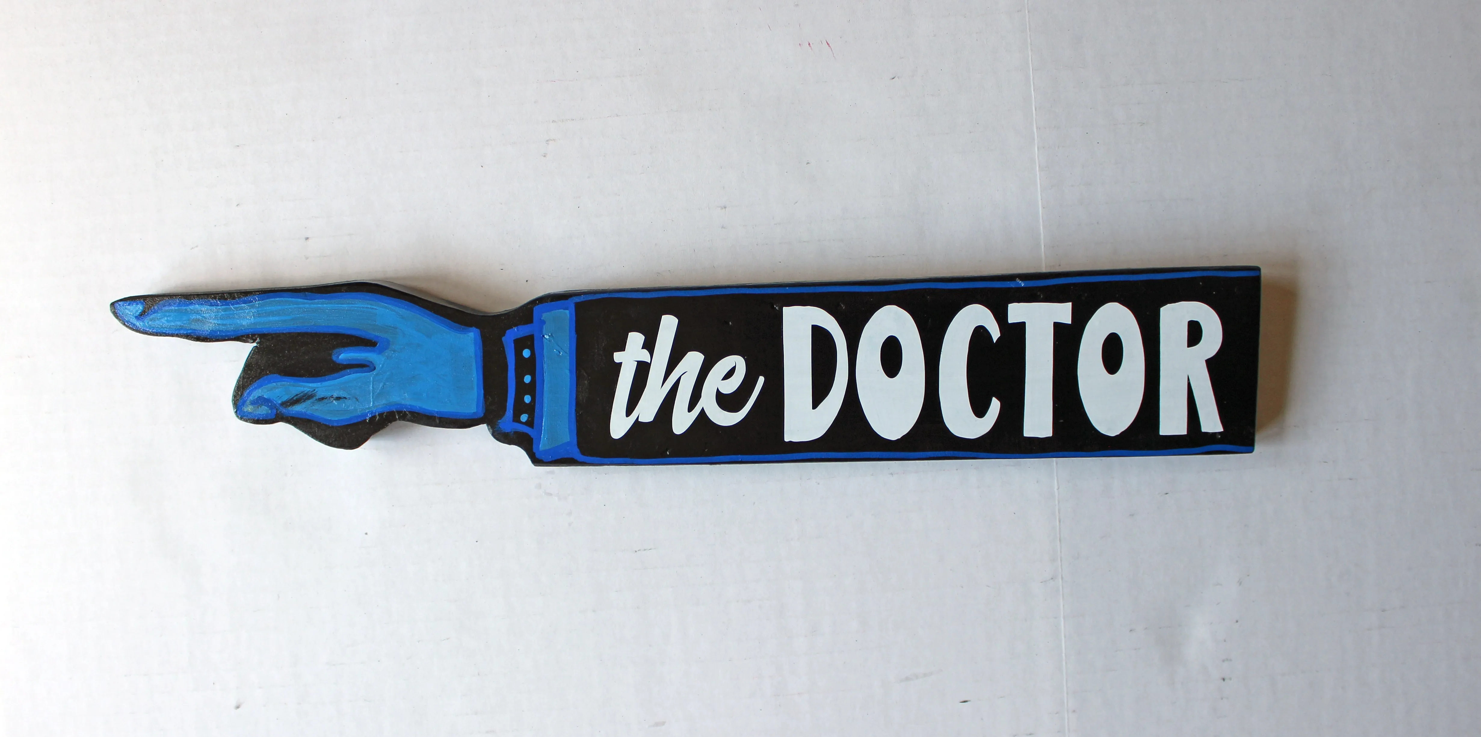 where's the doctor - wooden pointy finger signs