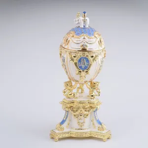 White Faberge Egg with an Elephant on Top