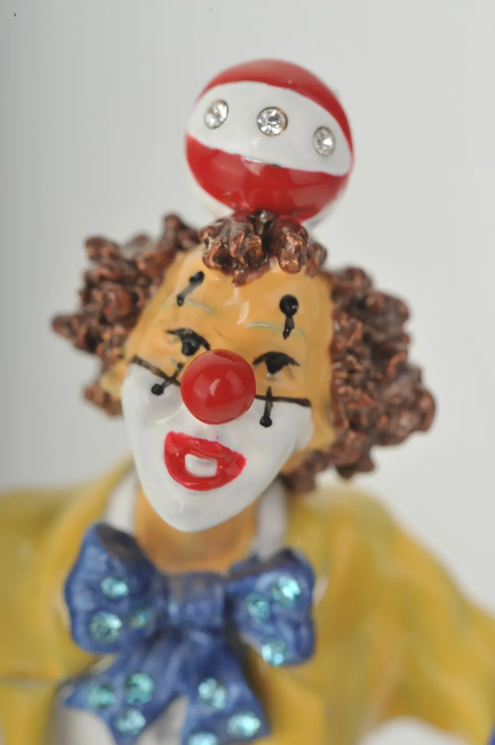 Yellow Circus Clown Juggling on Unicycle