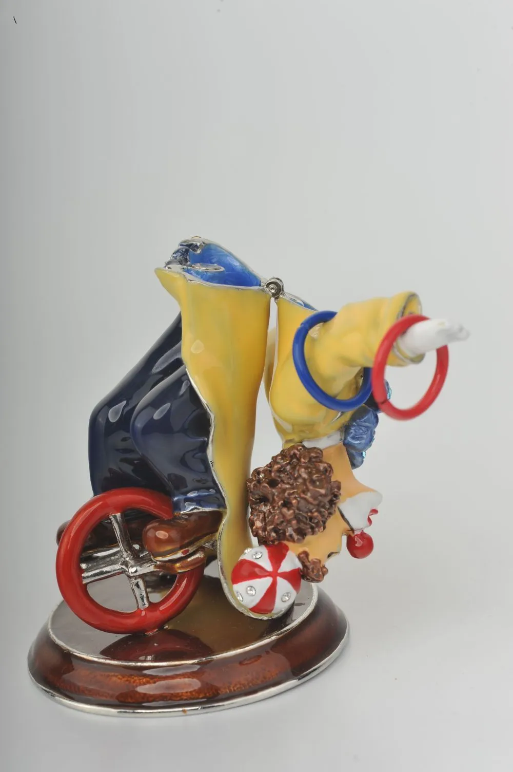 Yellow Circus Clown Juggling on Unicycle