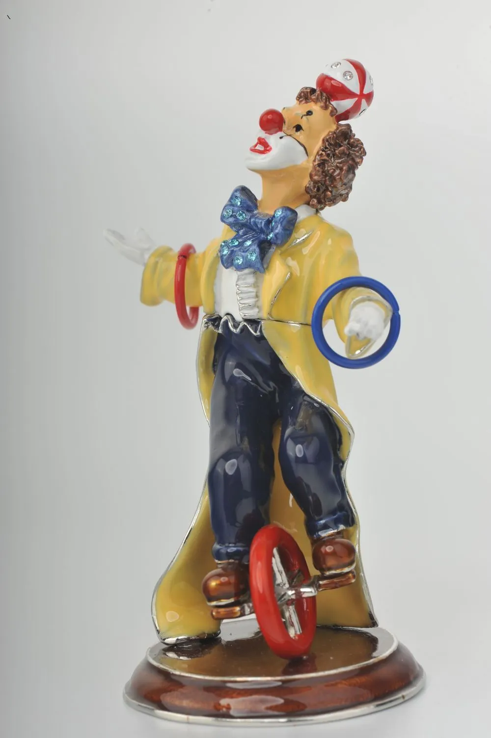 Yellow Circus Clown Juggling on Unicycle
