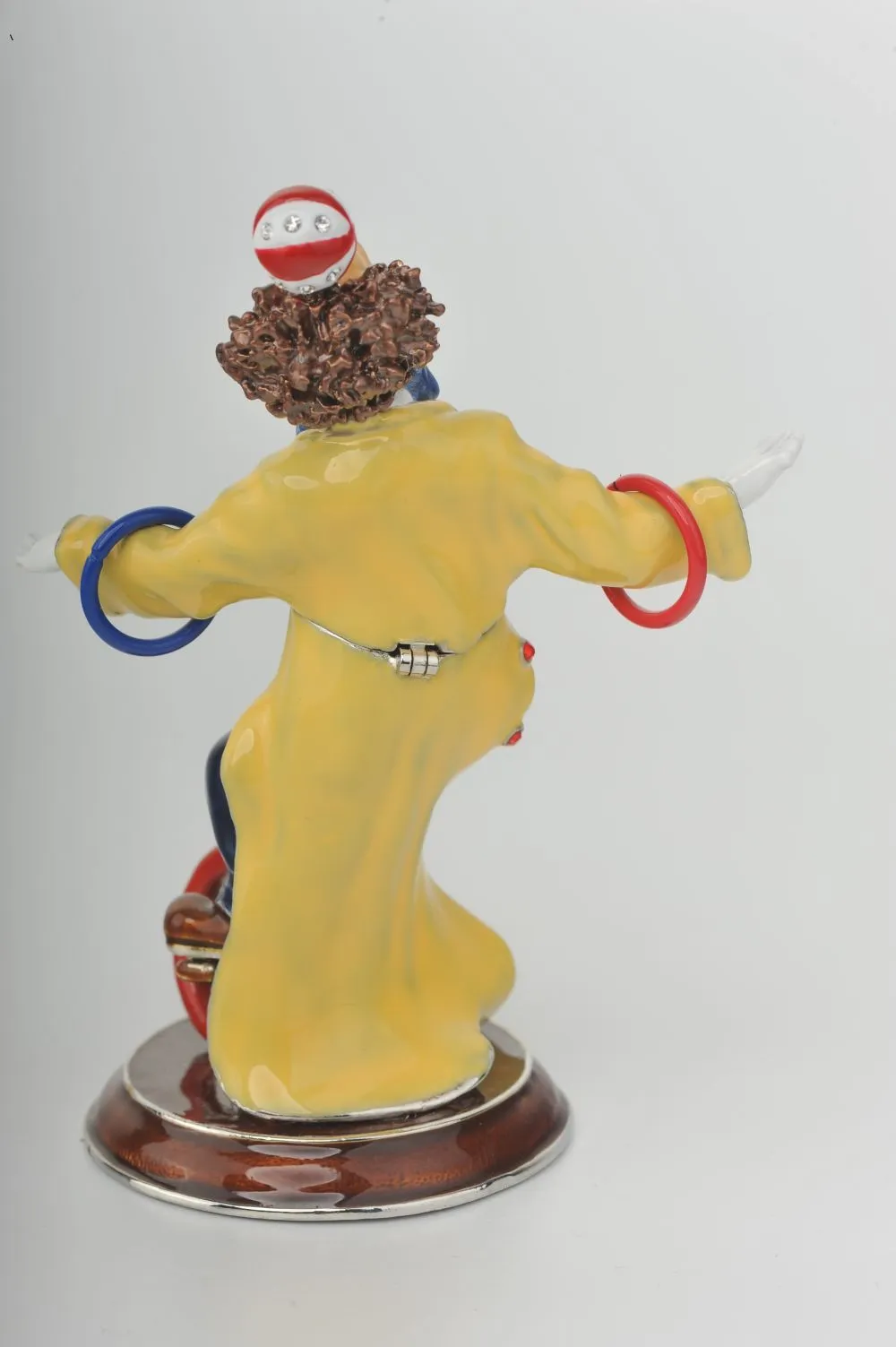 Yellow Circus Clown Juggling on Unicycle