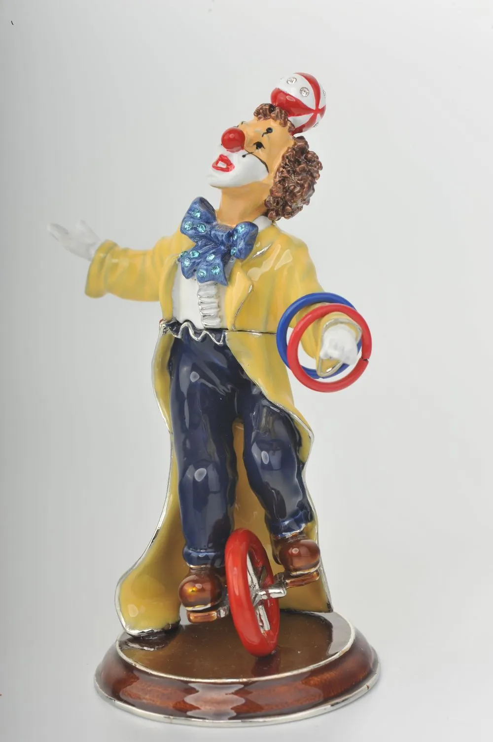 Yellow Circus Clown Juggling on Unicycle