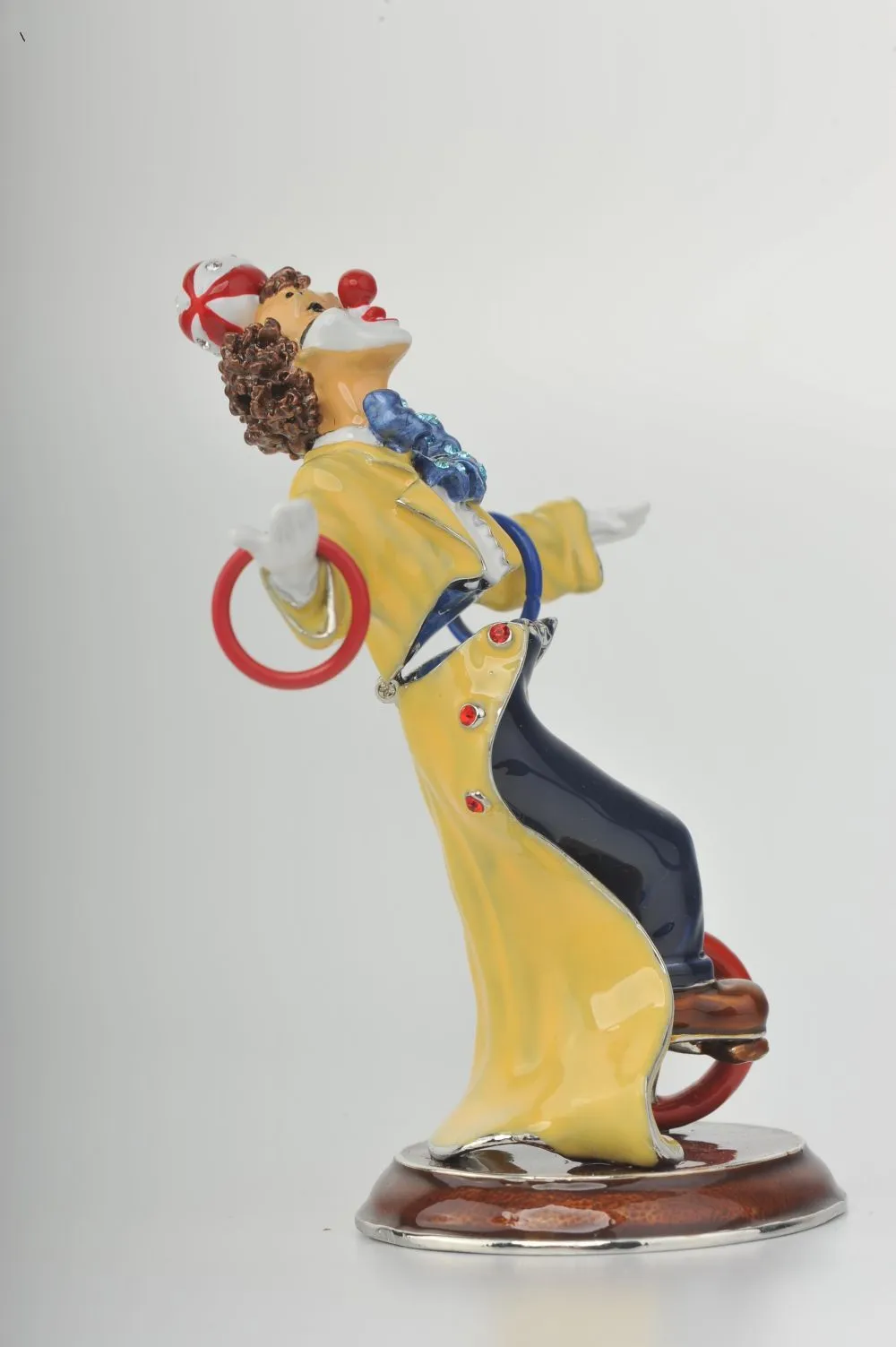 Yellow Circus Clown Juggling on Unicycle