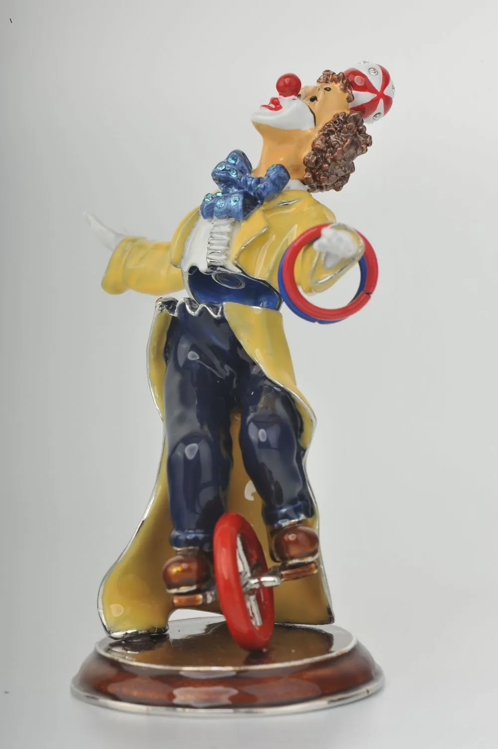 Yellow Circus Clown Juggling on Unicycle